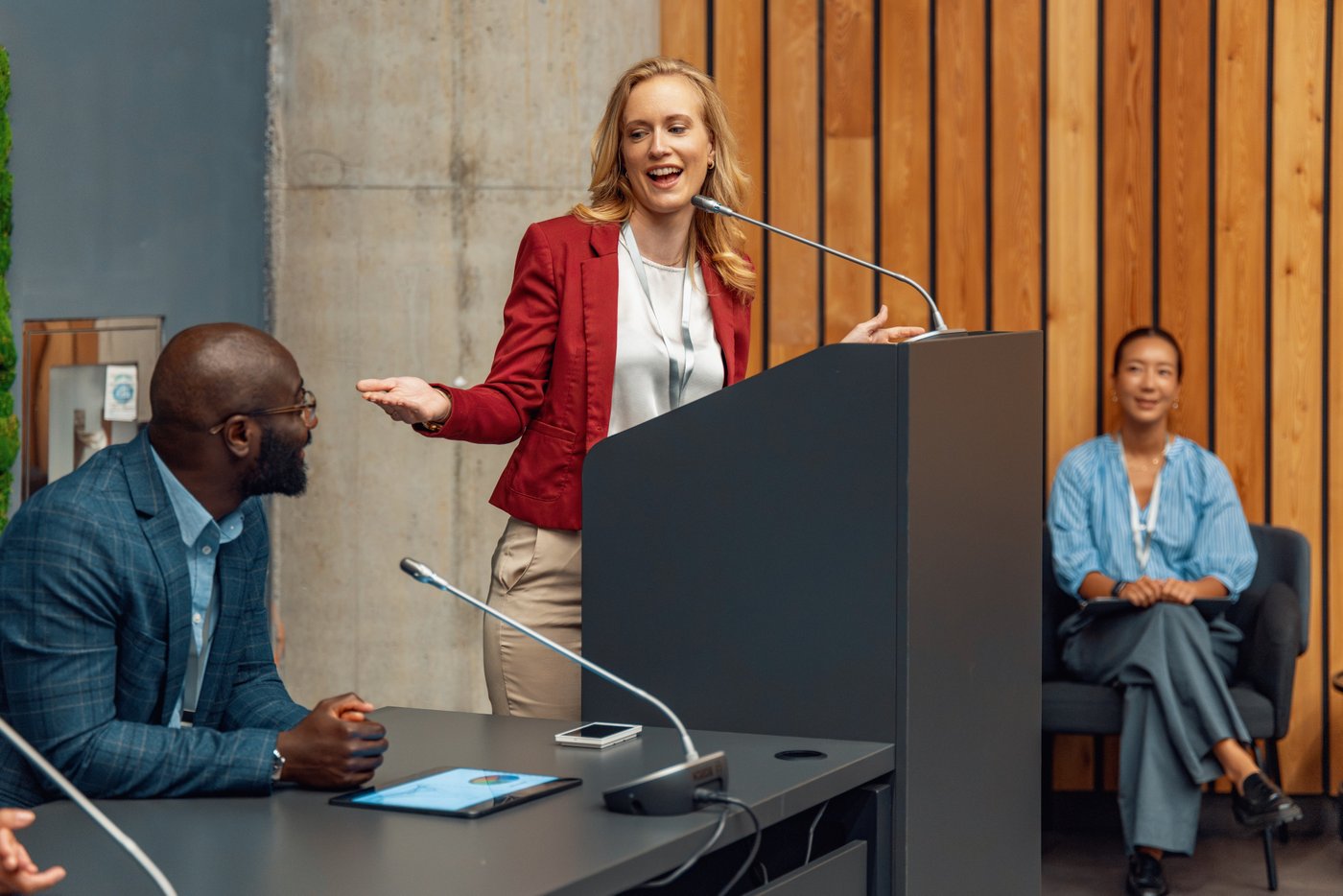 Business conference speaker presenting to an audience